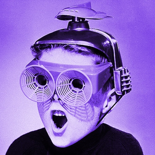 Boy wearing a tin hat with a rocket on top